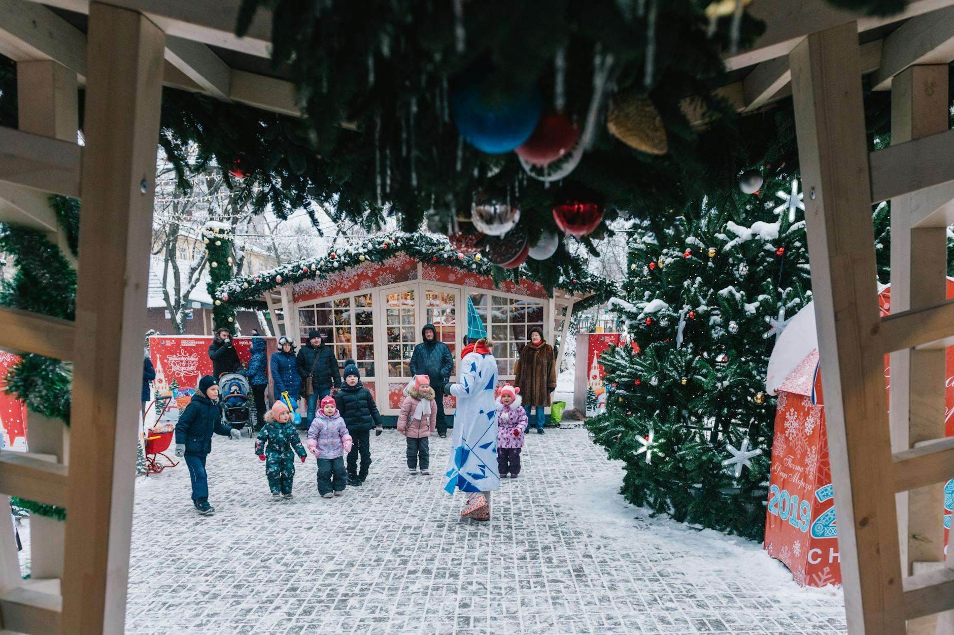 Munich Christmas Markets: Complete Guide 6 Family with children enjoying Munich Christmas market winter activities