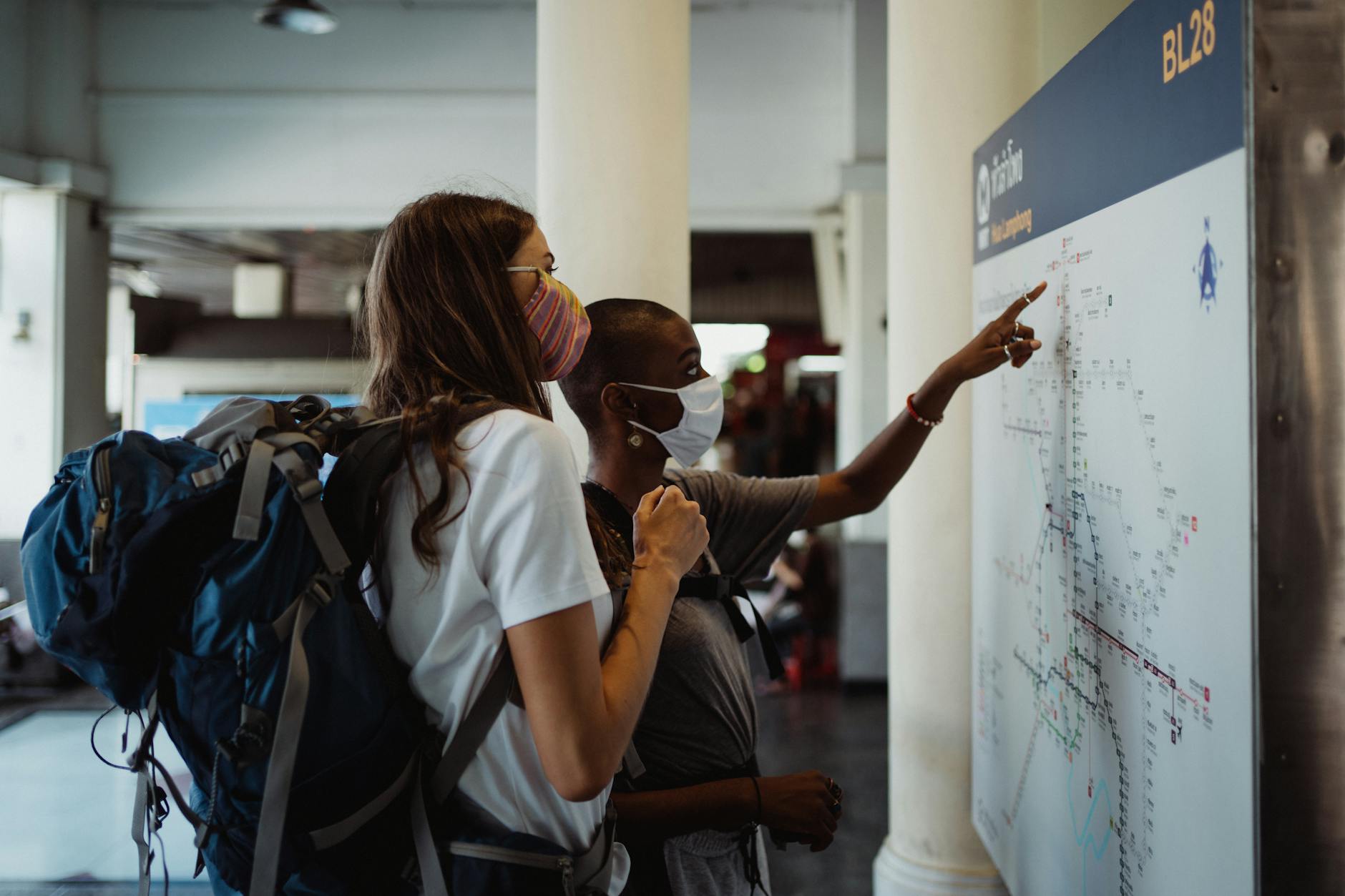 Budget backpacker with city map planning Munich itinerary