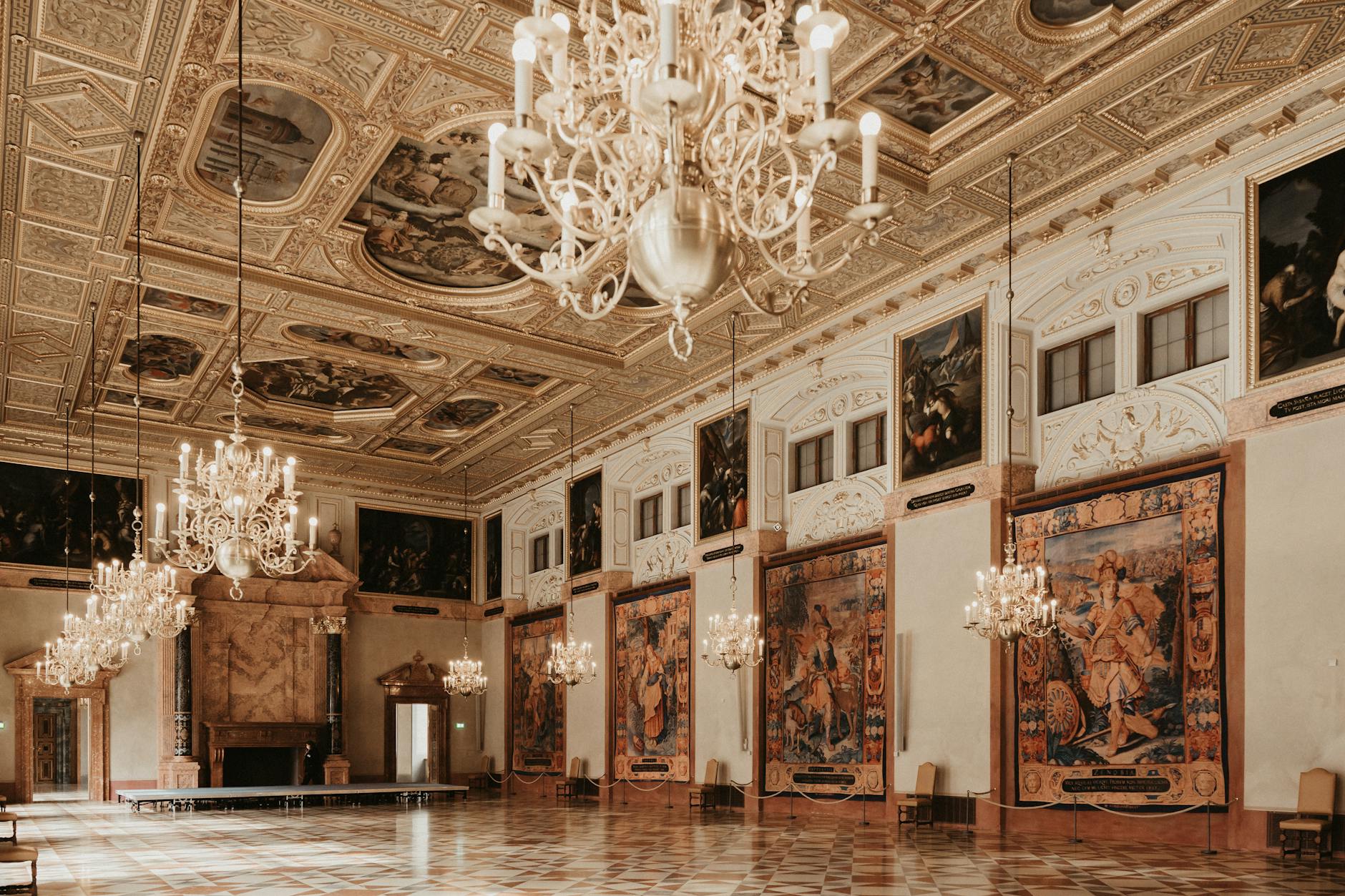 Munich Residenz baroque palace hall with ornate ceiling and chandeliers
