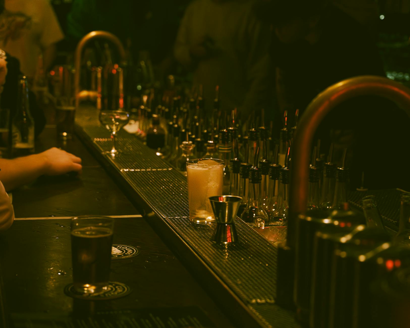 Speakeasy hidden bar moody dark wood candlelight Munich
