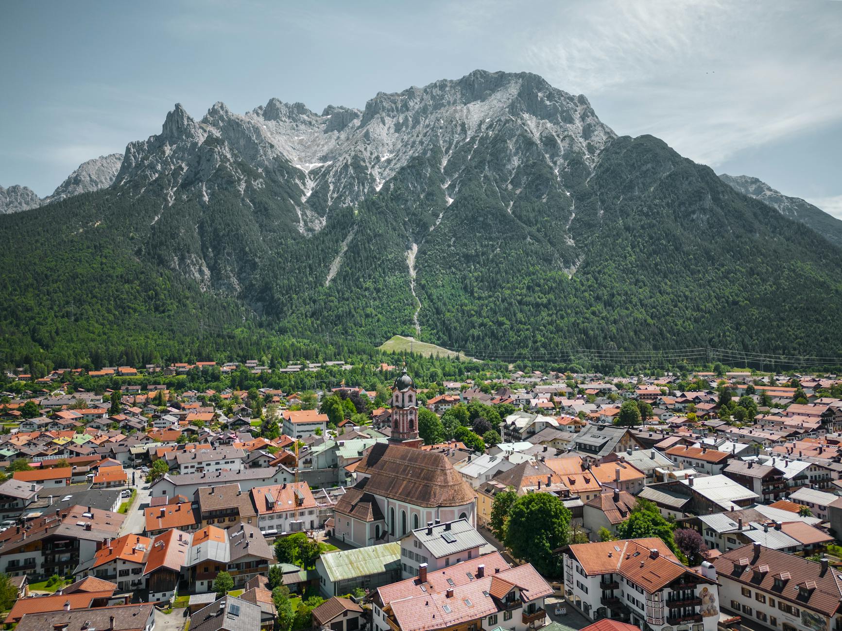 Bavarian Culture Traditions: A Visitor's Guide to Customs & Folklore 6 Bavarian Alpine village with mountain backdrop and traditional houses
