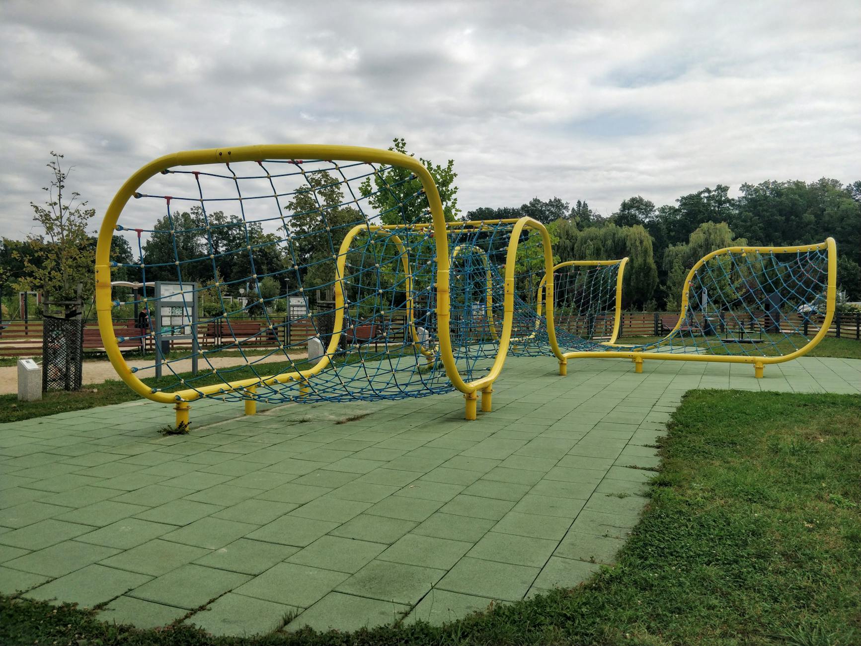Family Hotels in Munich: 15 Best Kid-Friendly Stays for 2026 5 Kids playing in English Garden near Munich family hotel with playground and Eisbach in background