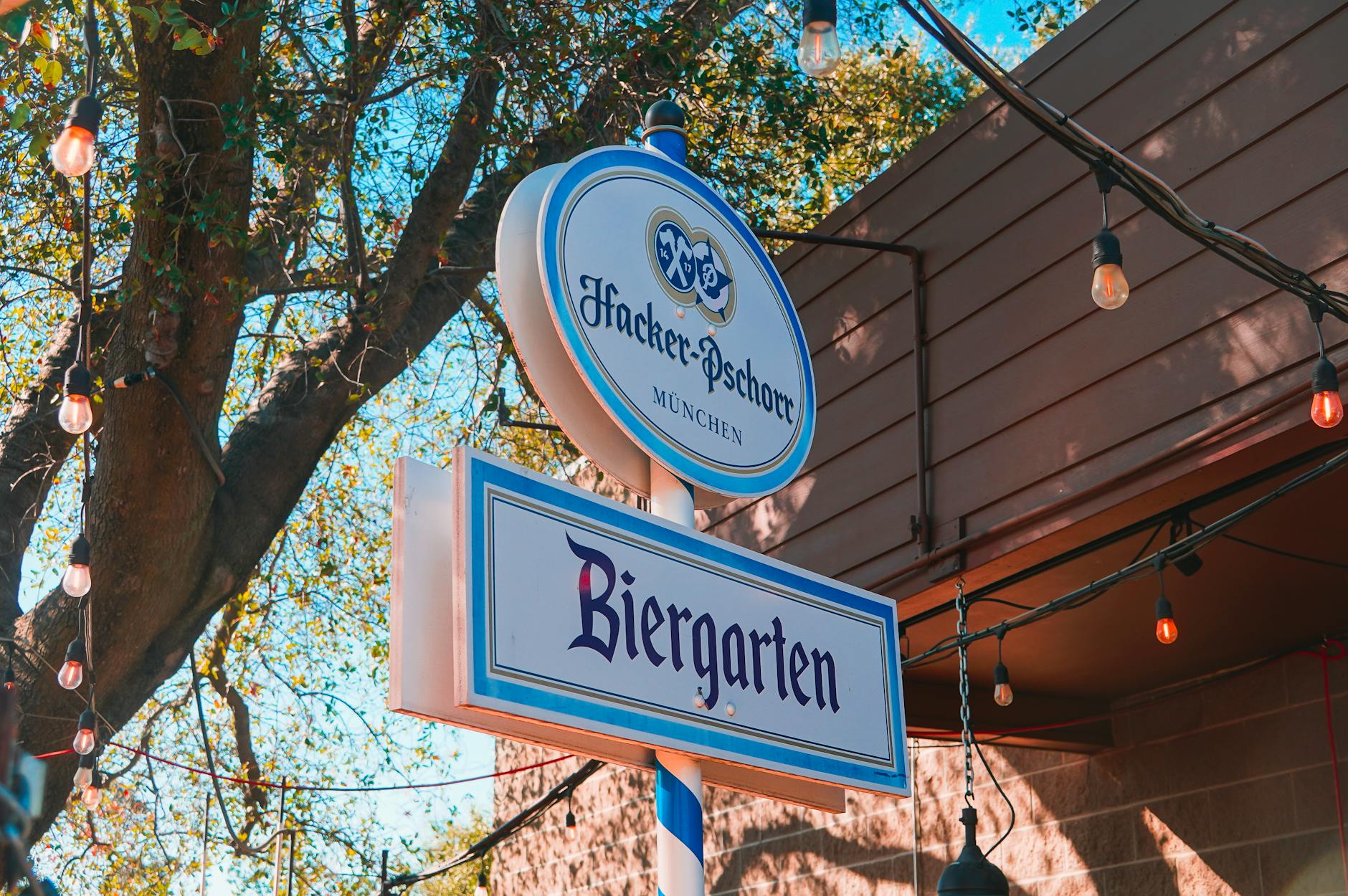 German Phrases for Munich Tourists: Essential Words & Bavarian Dialect 3 Bavarian dialect phrases on a Munich bakery sign with Gruss Gott and Brezn for sale