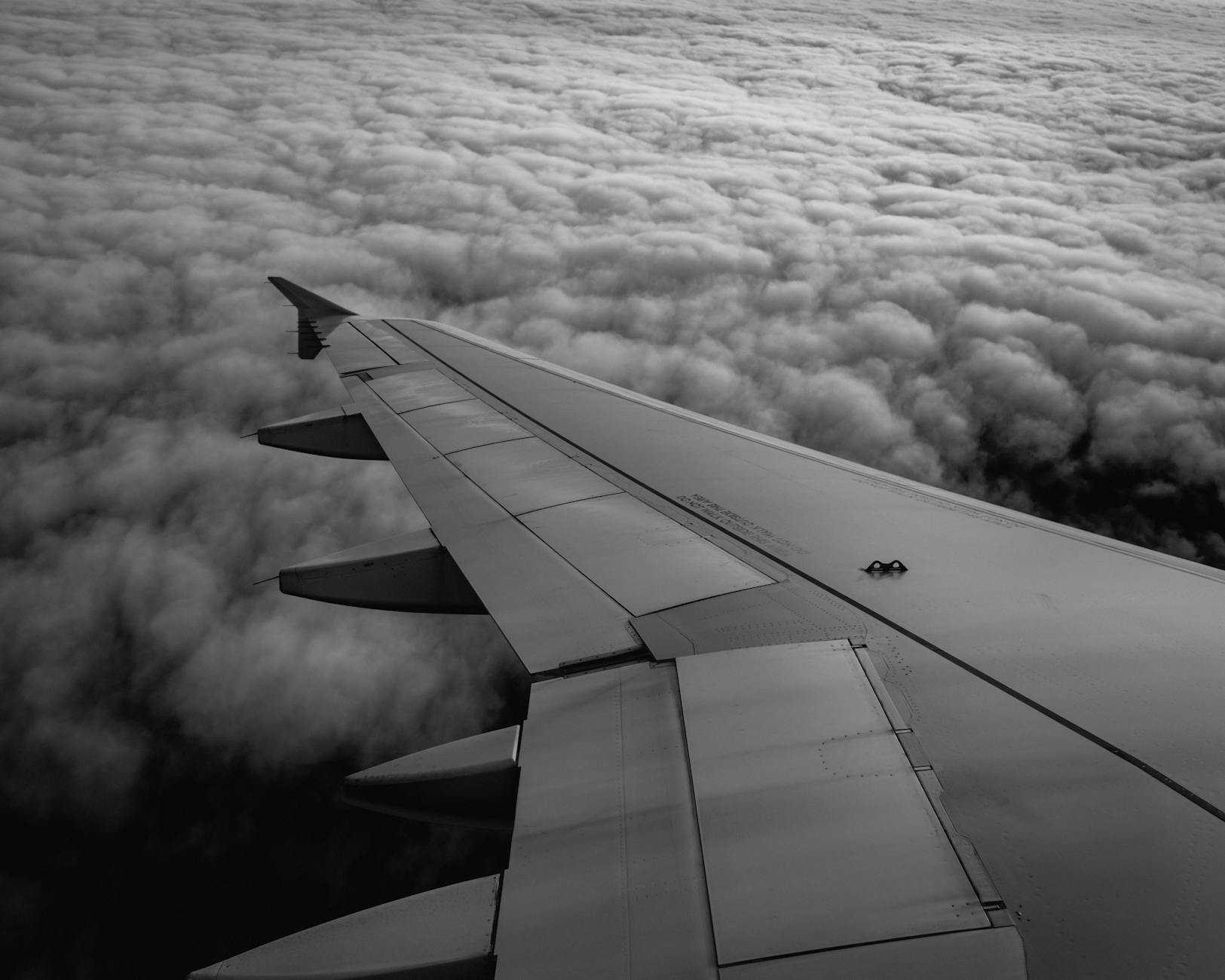Airplane flying over clouds