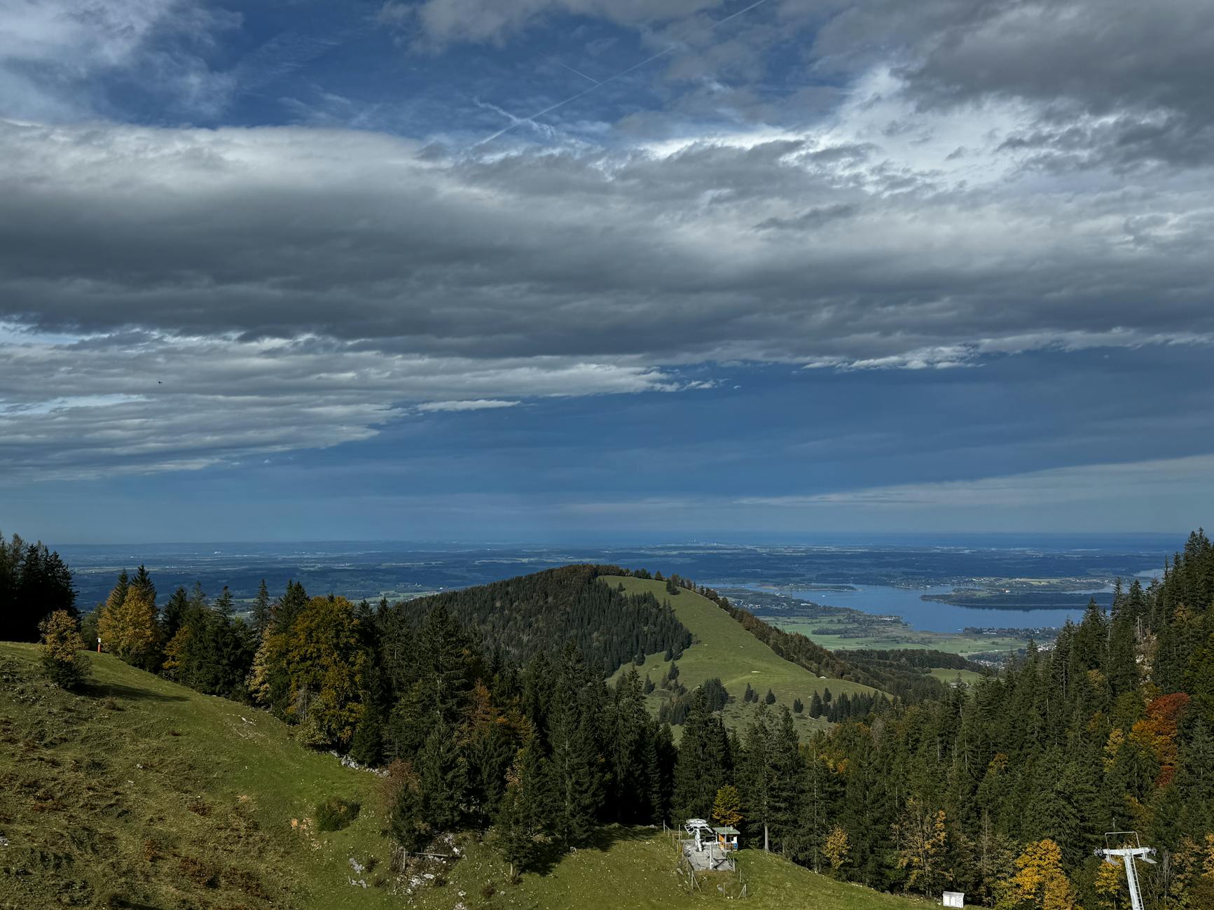 Hiking near Munich on a Bavarian Alps summit with lake views