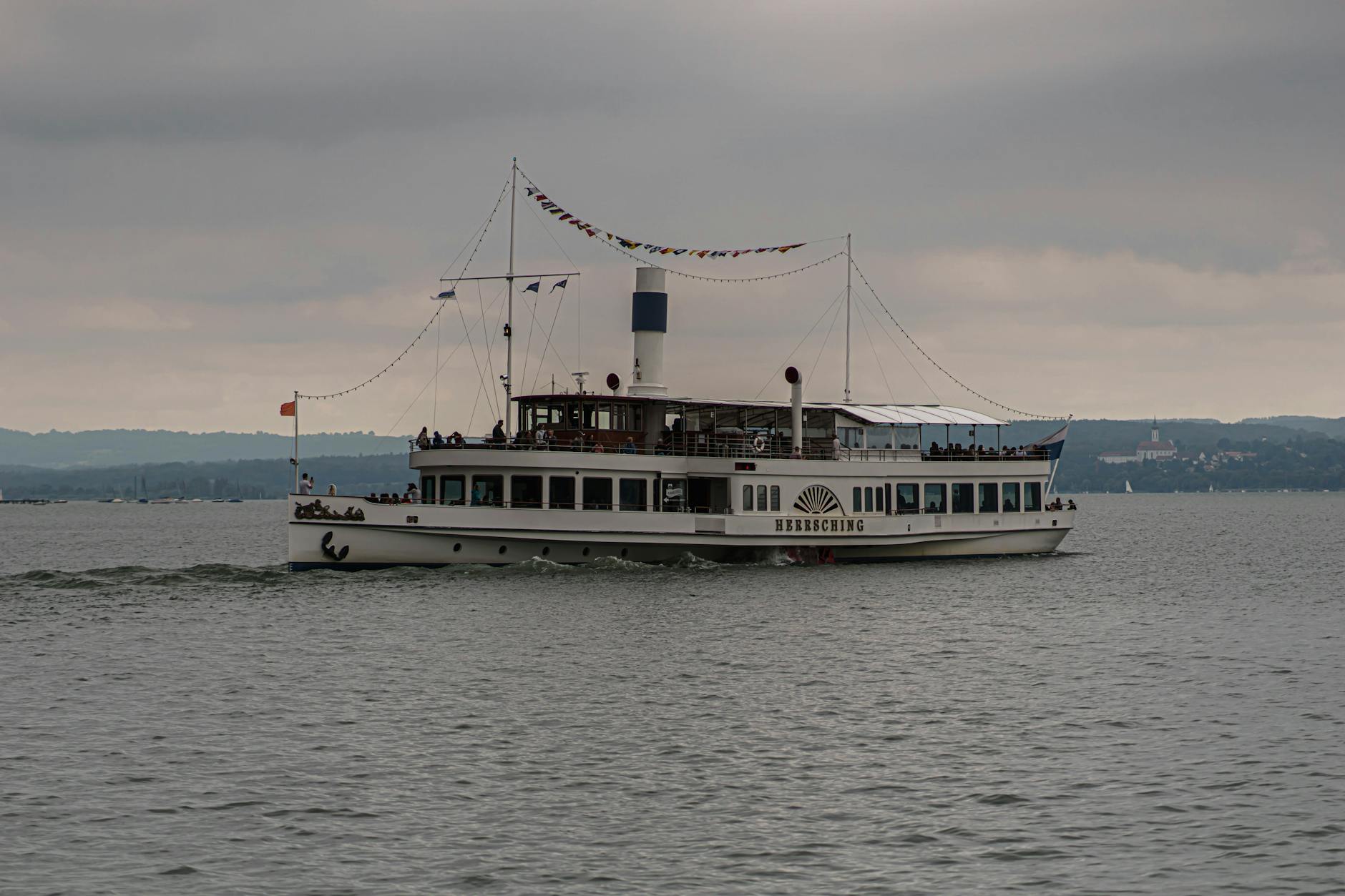 Best Lakes Near Munich: Swimming, Boating & Day Trips 3 Ammersee Bavarian lake near Munich with Andechs monastery on hill and steamer ferry