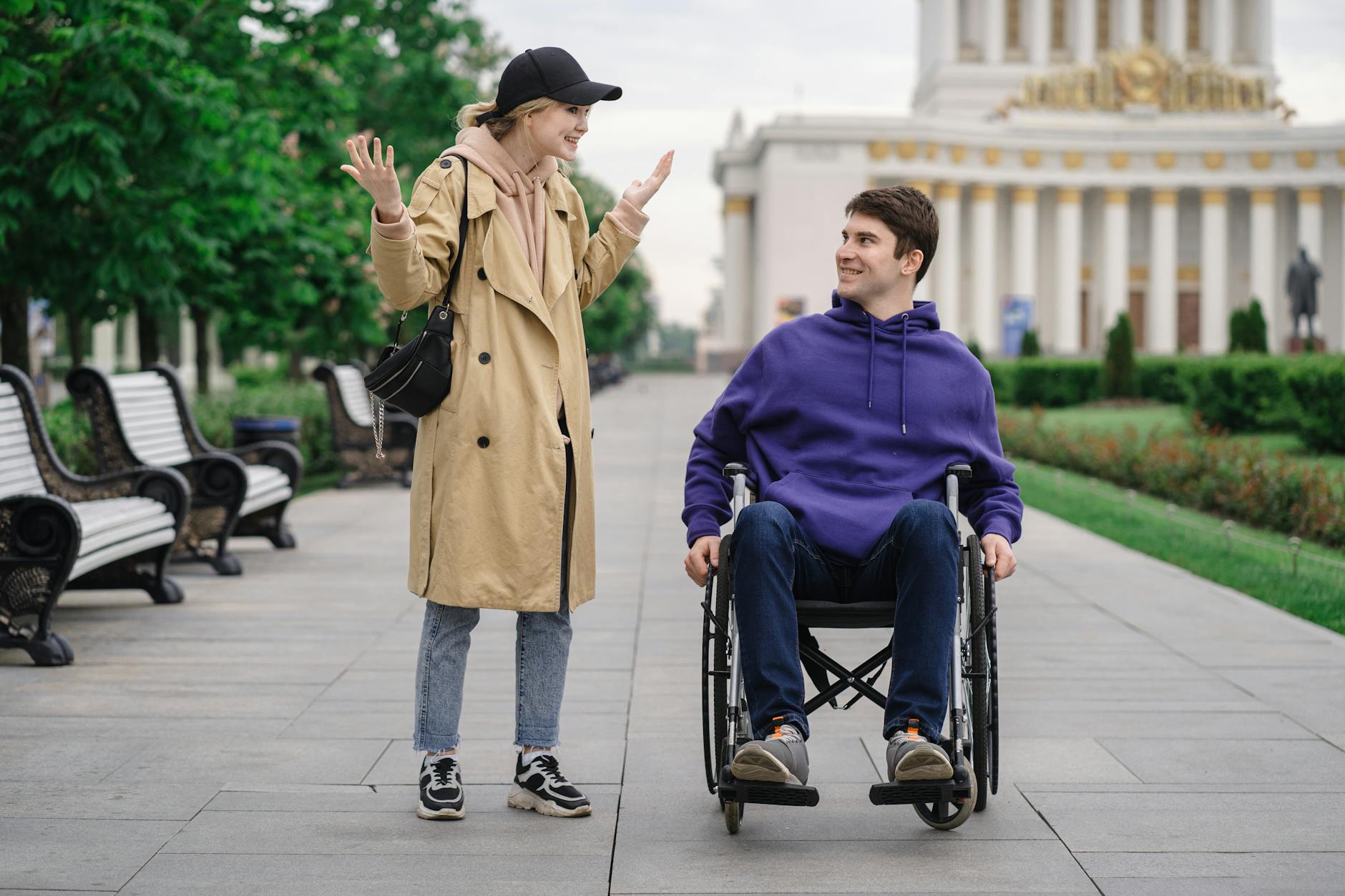 Disabled access Munich wheelchair user at Englischer Garten paved path with benches