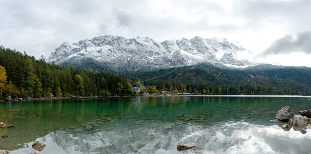 Zugspitze from Munich: Germany's Highest Peak 1 The Eibsee with the snow-dusted Zugspitze massif rising behind the forest