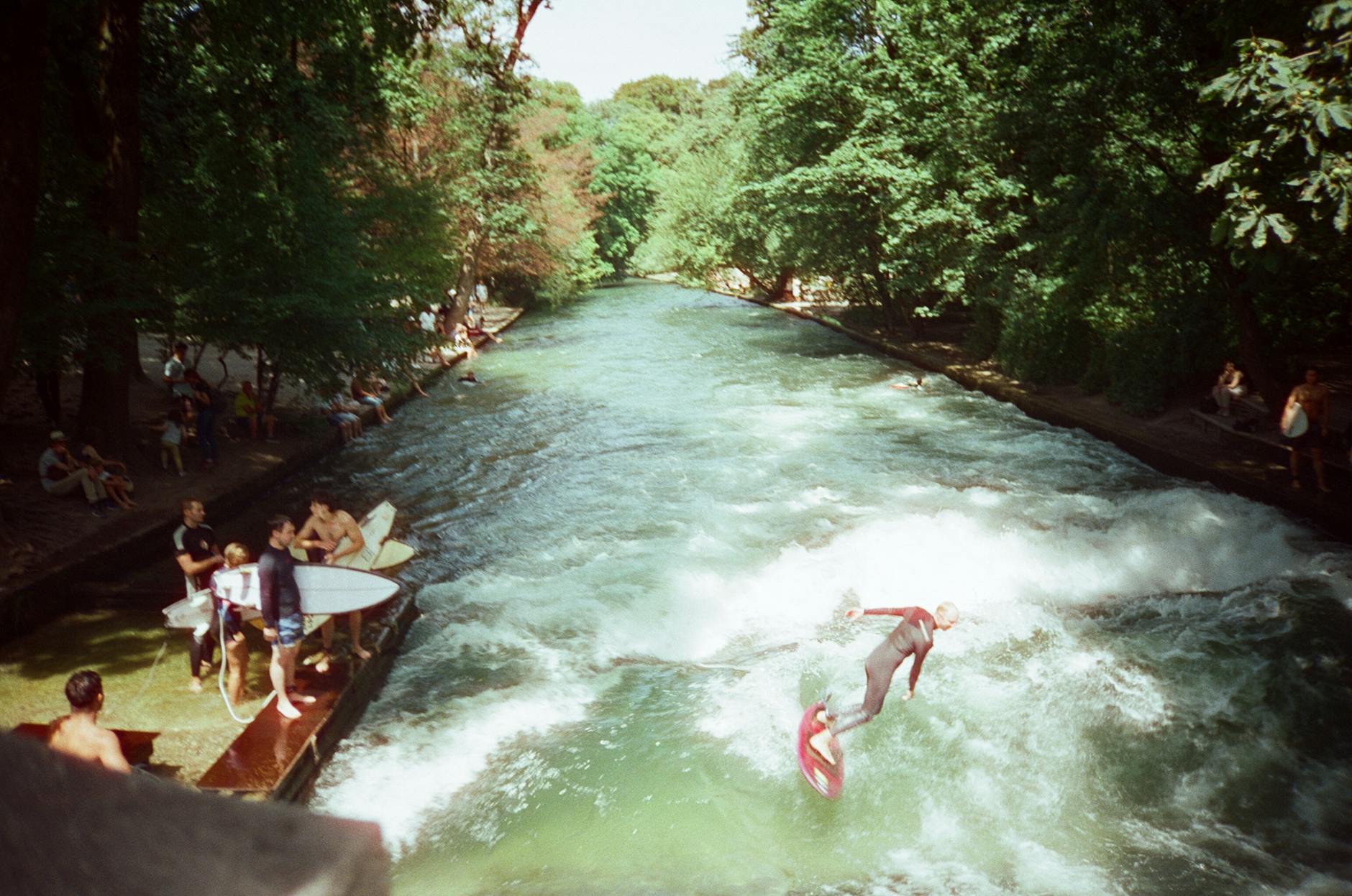 Munich outdoor activities at the Eisbach surf wave in the English Garden