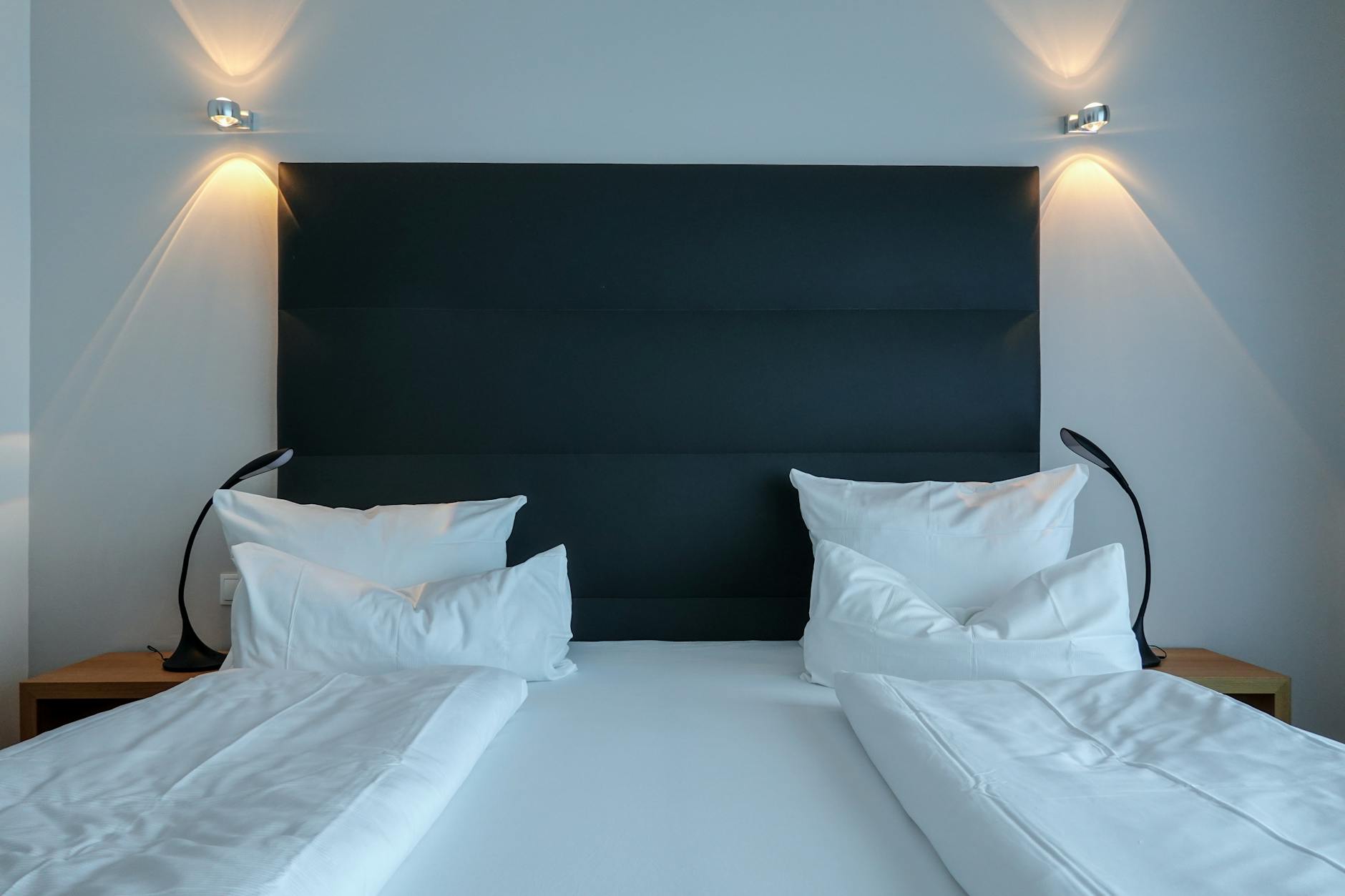 Family Hotels in Munich: 15 Best Kid-Friendly Stays for 2026 3 Family room at a Munich hotel with two queen beds, child's bed, and city view