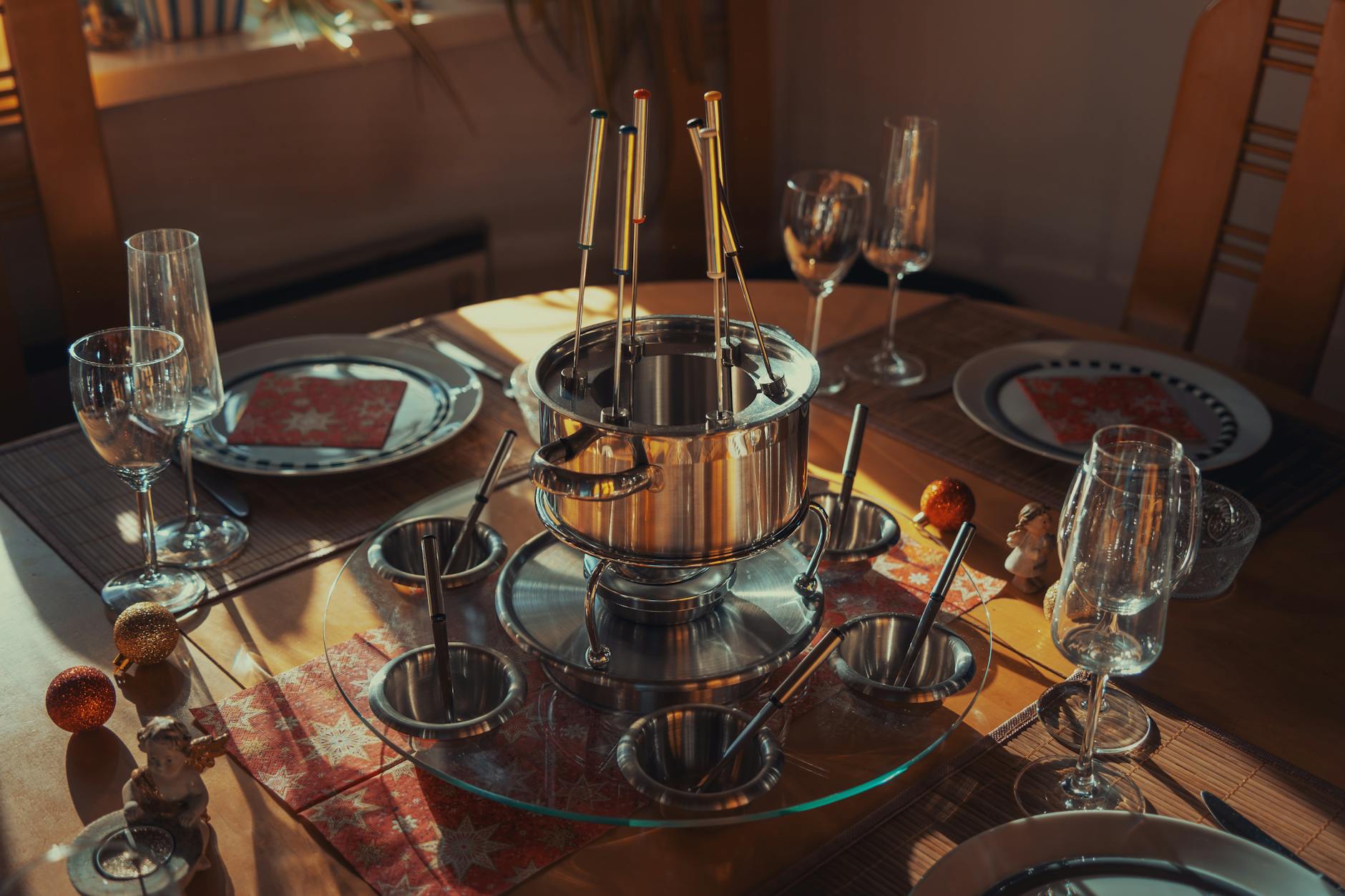 Munich New Year's Eve: Silvester Celebration Guide for 2026 3 Bavarian Silvester dinner table with raclette fondue Schweinshaxe Sekt and Berliner doughnuts