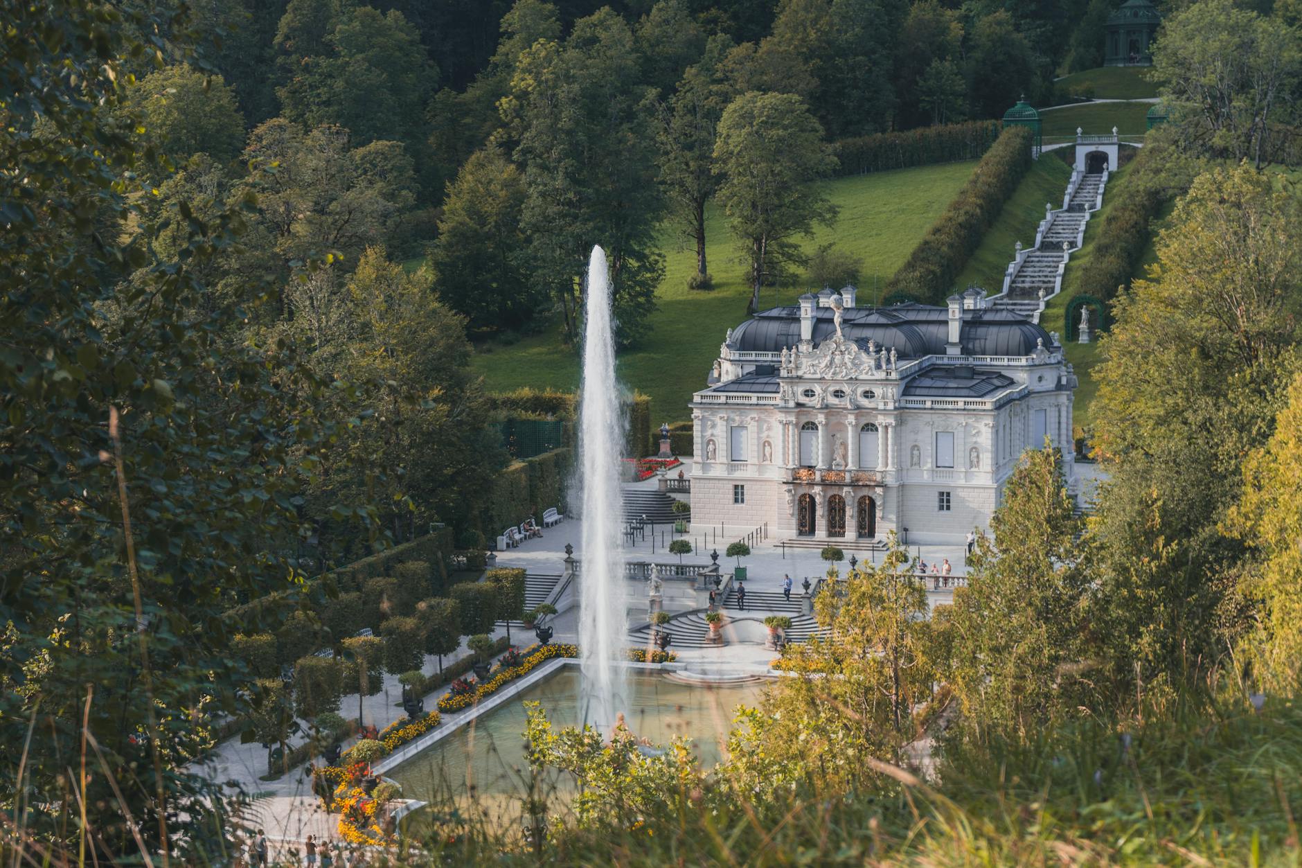 Linderhof Palace day trip view of the white rococo facade and water parterre