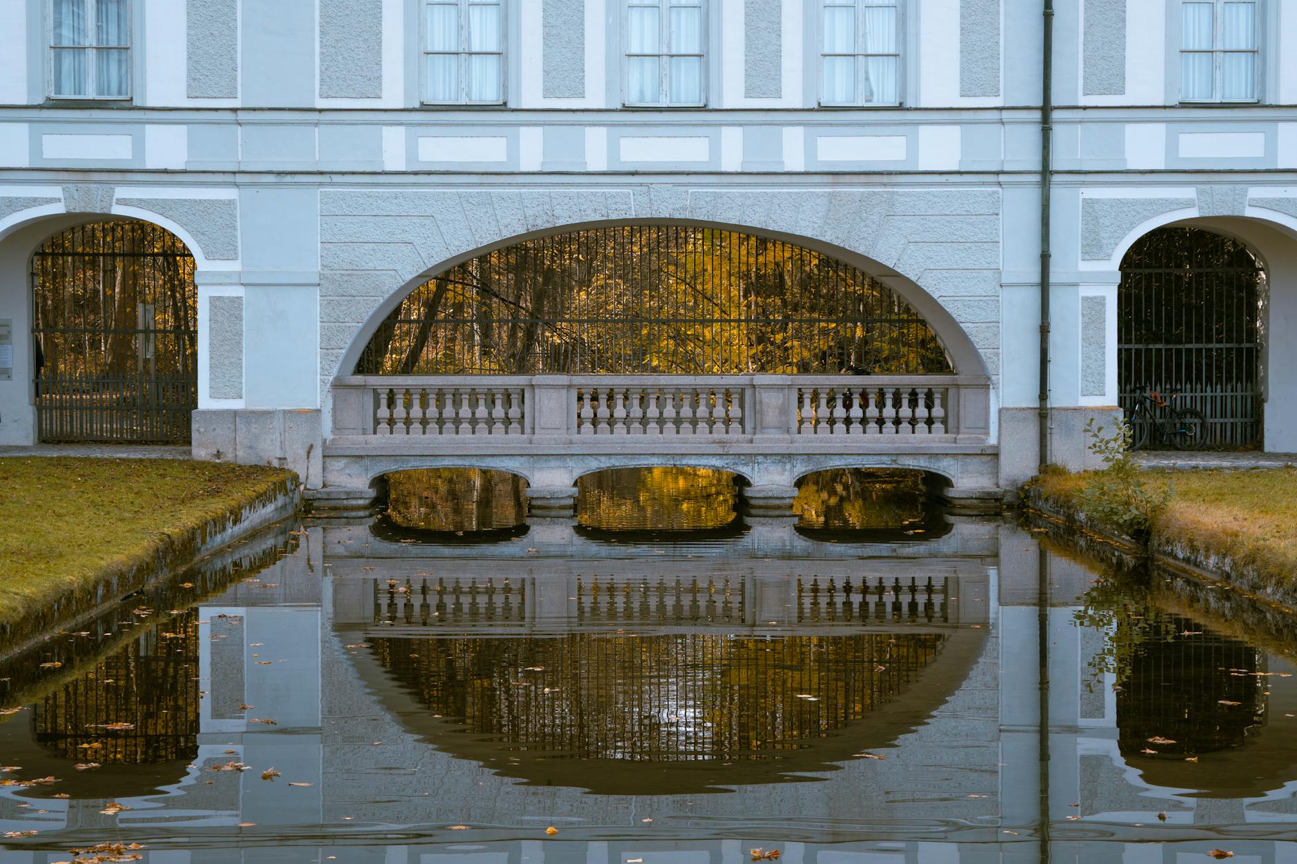 Romantic things to do in Munich couple at Nymphenburg Palace canal at sunset
