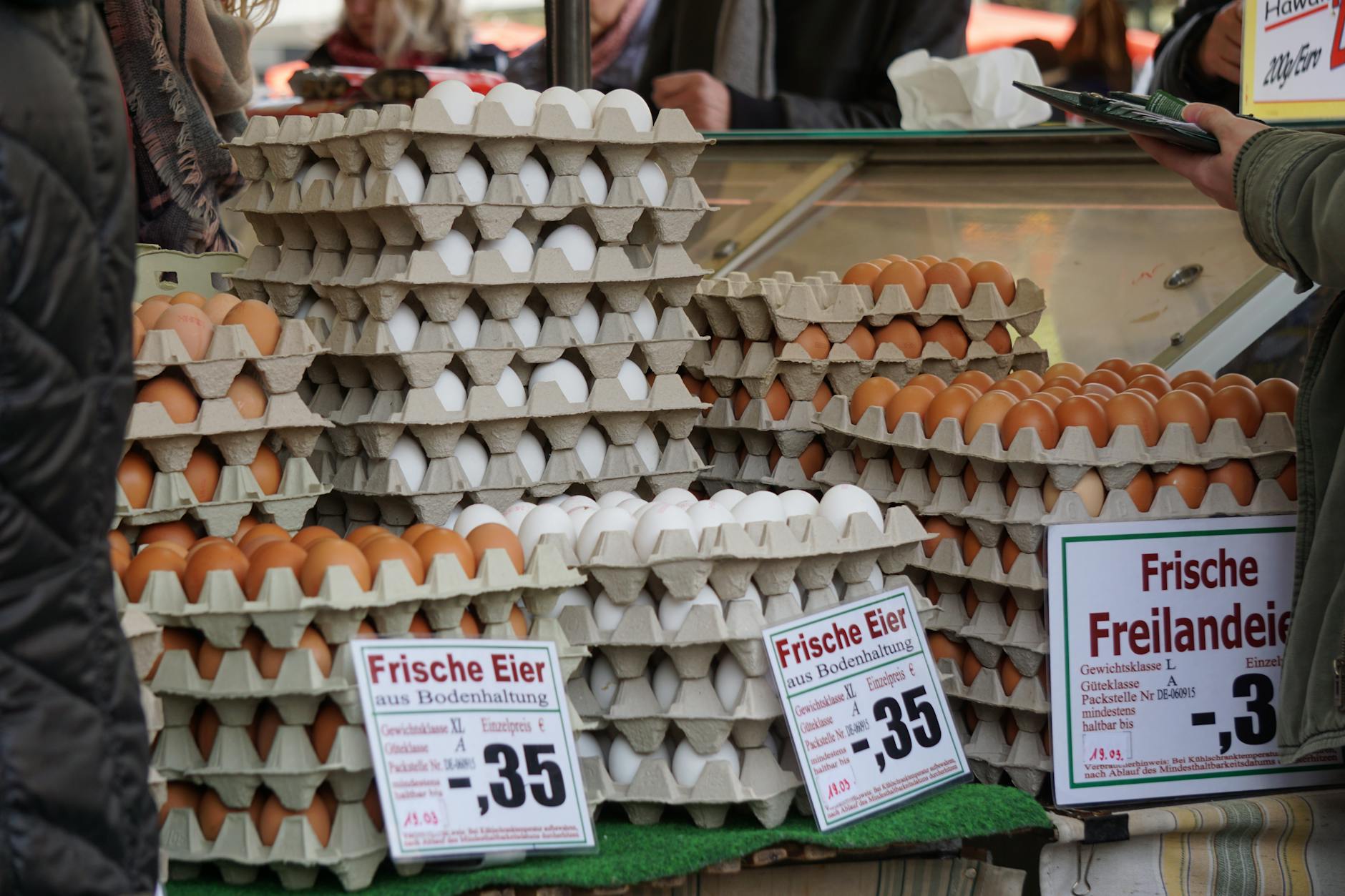 Sendling and Westpark: Munich's Green South 4 Trays of eggs on a market stall with German price signs for fresh free-range eggs