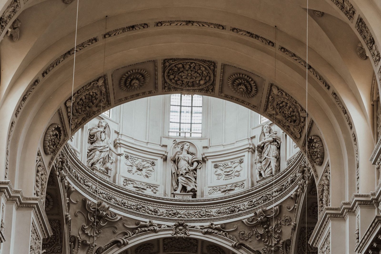 Ornate Baroque interior detail in a Munich church showing gilded stucco and frescoes