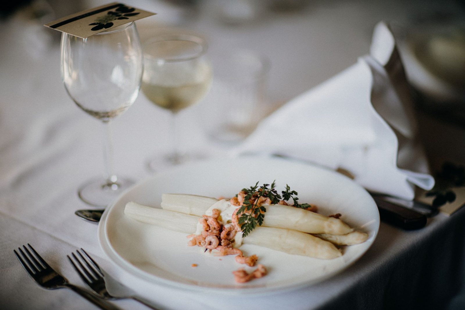 Plate of white asparagus with hollandaise, a Munich Spargelzeit spring specialty