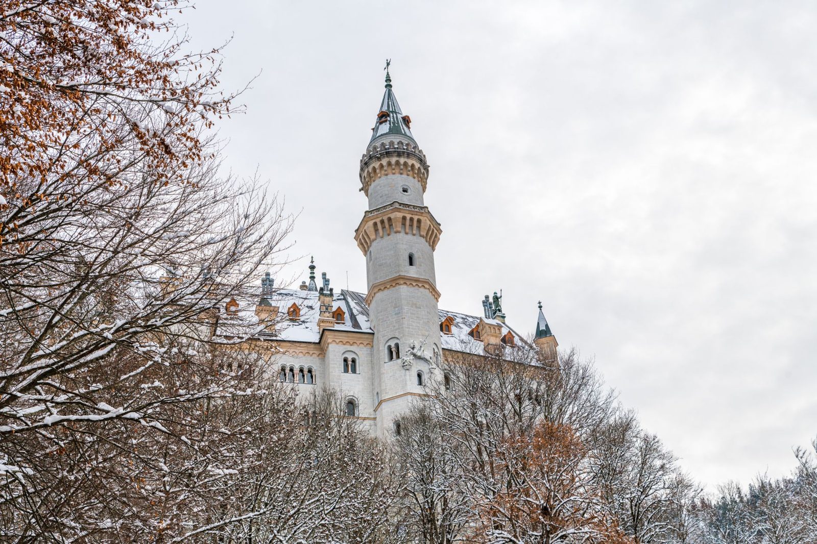 Munich Weather & Packing Guide 7 Snow falling over Munich's old town rooftops in winter