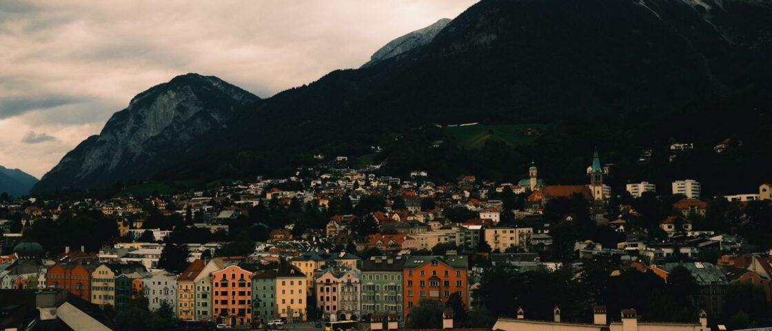 Innsbruck's coloured townhouses beneath the limestone wall of the Nordkette range