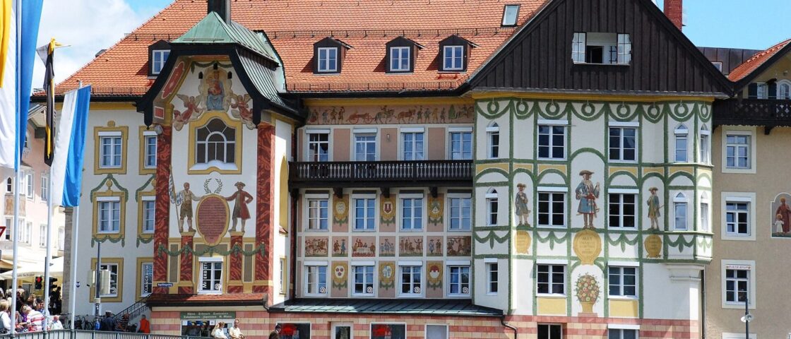 Painted façades of the former Marienstift and neighbouring houses on the Marktstraße in Bad Tölz, beside the bridge
