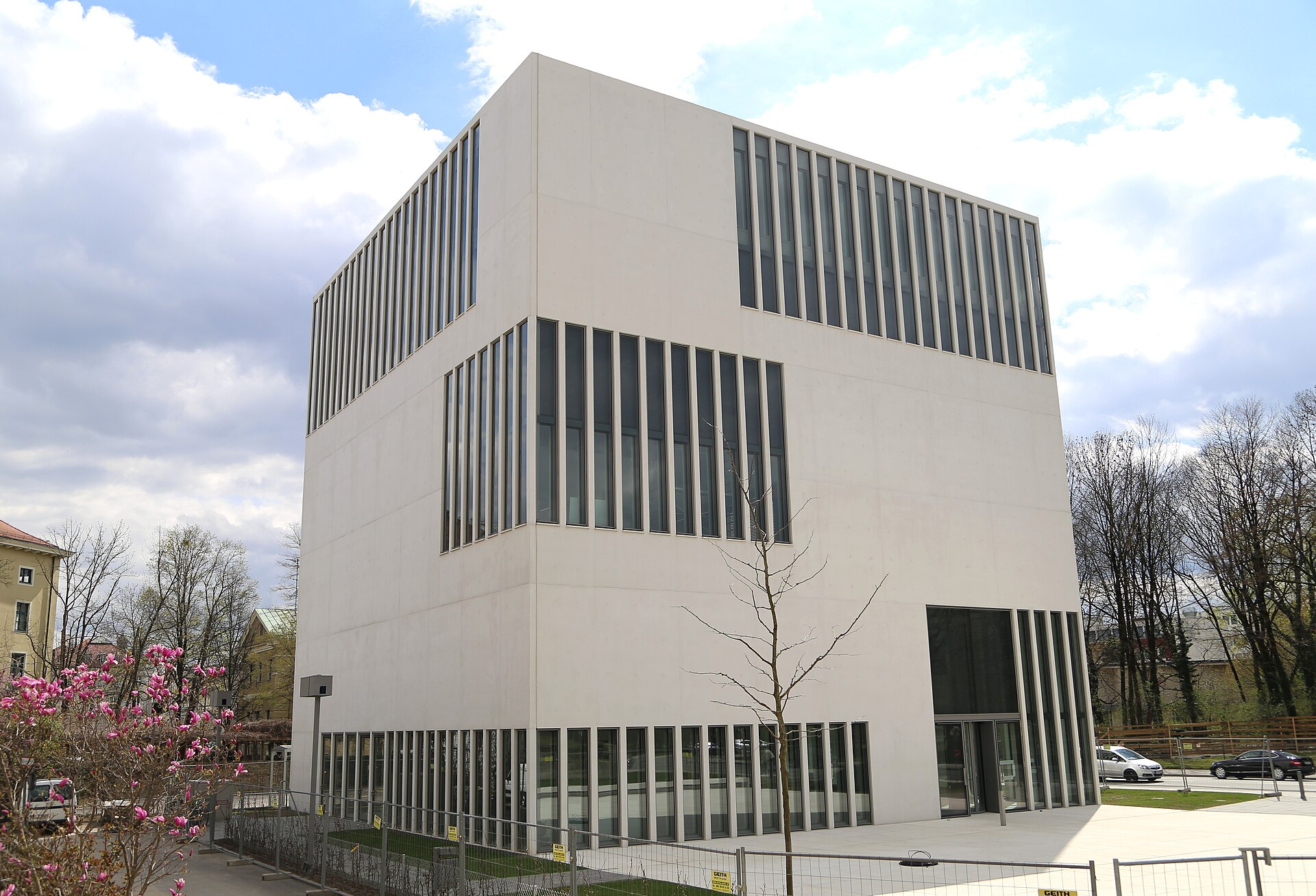 Best History Museums in Munich: From Royals to WWII 2 A corner view of Munich’s NS Documentation Centre shows its pale walls, tall window bands and recessed glass doorway.